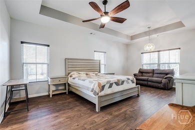 Spacious 5-bed, 3-bath home w/ a 3-car garage on over an acre in on Lost Plantation Golf Club in Georgia - for sale on GolfHomes.com, golf home, golf lot