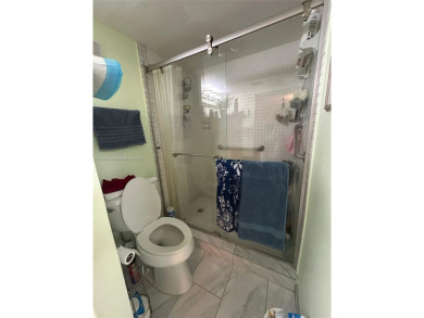 Large corner unit rarely available with a golf and garden view on Pembroke Lakes Golf Club in Florida - for sale on GolfHomes.com, golf home, golf lot