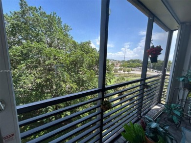 Large corner unit rarely available with a golf and garden view on Pembroke Lakes Golf Club in Florida - for sale on GolfHomes.com, golf home, golf lot