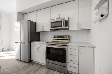 Lakeside living. First level condo conveniently situated on NCSU on Lonnie Poole Golf Course in North Carolina - for sale on GolfHomes.com, golf home, golf lot