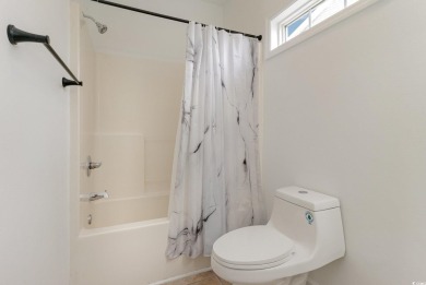This is a beautifully upgraded end-unit 3-bedroom/2-bathroom on Heron Point Golf Club in South Carolina - for sale on GolfHomes.com, golf home, golf lot