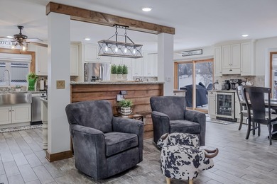 Step into your dream home in the coveted Lakes of the Four on Lakes of the Four Seasons Country Club in Indiana - for sale on GolfHomes.com, golf home, golf lot