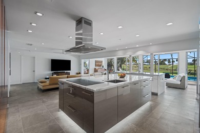 This stunning 5 Bedroom plus Den home overlooking the North Palm on North Palm Beach Country Club in Florida - for sale on GolfHomes.com, golf home, golf lot