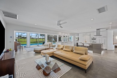 This stunning 5 Bedroom plus Den home overlooking the North Palm on North Palm Beach Country Club in Florida - for sale on GolfHomes.com, golf home, golf lot