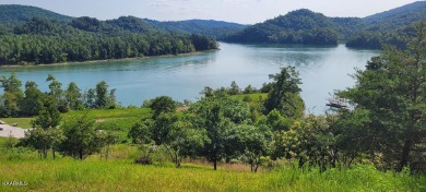 This lot has a 180-degree view of Norris Lake and Lone Mountain on Woodlake Golf Club in Tennessee - for sale on GolfHomes.com, golf home, golf lot