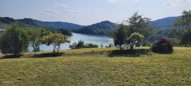 This lot has a 180-degree view of Norris Lake and Lone Mountain on Woodlake Golf Club in Tennessee - for sale on GolfHomes.com, golf home, golf lot