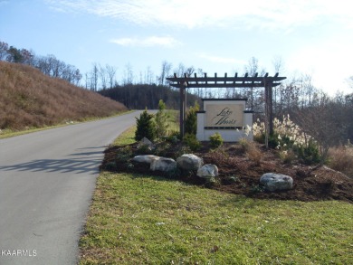 This lot has a 180-degree view of Norris Lake and Lone Mountain on Woodlake Golf Club in Tennessee - for sale on GolfHomes.com, golf home, golf lot