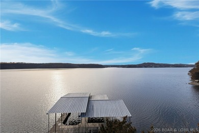 Located in the iconic Tan Tar A Estates, adjacent to on The Oaks Golf Course in Missouri - for sale on GolfHomes.com, golf home, golf lot