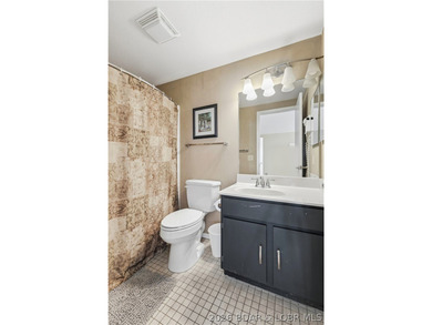 Located in the iconic Tan Tar A Estates, adjacent to on The Oaks Golf Course in Missouri - for sale on GolfHomes.com, golf home, golf lot