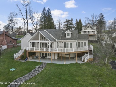 Indulge in the epitome of lakeside luxury at this extraordinary on Scranton Canoe Club in Pennsylvania - for sale on GolfHomes.com, golf home, golf lot