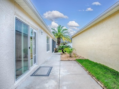 LOCATION is everything with this 2/2 block and stucco Woodlawn on Bacall Executive Golf Course in Florida - for sale on GolfHomes.com, golf home, golf lot