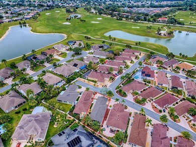 LOCATION is everything with this 2/2 block and stucco Woodlawn on Bacall Executive Golf Course in Florida - for sale on GolfHomes.com, golf home, golf lot
