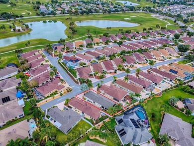 LOCATION is everything with this 2/2 block and stucco Woodlawn on Bacall Executive Golf Course in Florida - for sale on GolfHomes.com, golf home, golf lot