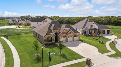 This highly sought-after single-story Altura Aspen floorplan is on Heath Golf and Yacht Club in Texas - for sale on GolfHomes.com, golf home, golf lot