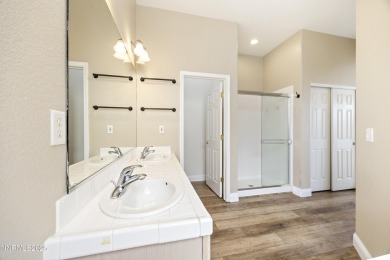 Located on the 4th hole of Dayton Valley Golf Club, this home on Dayton Valley Golf Club At Legado in Nevada - for sale on GolfHomes.com, golf home, golf lot