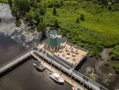 Discover a stunning 4-bedroom waterfront home in the prestigious on Heritage Club in South Carolina - for sale on GolfHomes.com, golf home, golf lot