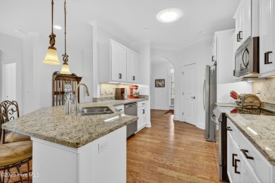 Experience elegant, low-maintenance living in this stunning on Cape Fear National At Brunswick Forest in North Carolina - for sale on GolfHomes.com, golf home, golf lot