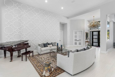 Welcome to an extraordinary, fully reimagined contemporary on Bocaire Country Club in Florida - for sale on GolfHomes.com, golf home, golf lot