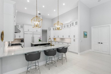 Welcome to an extraordinary, fully reimagined contemporary on Bocaire Country Club in Florida - for sale on GolfHomes.com, golf home, golf lot