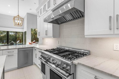 Welcome to an extraordinary, fully reimagined contemporary on Bocaire Country Club in Florida - for sale on GolfHomes.com, golf home, golf lot