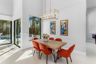 Welcome to an extraordinary, fully reimagined contemporary on Bocaire Country Club in Florida - for sale on GolfHomes.com, golf home, golf lot