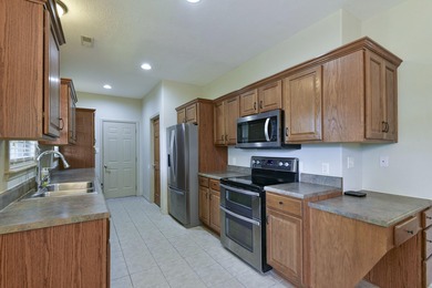 Charming home in this beautiful golf course community. there is on Ledgestone Country Club and Golf Course in Missouri - for sale on GolfHomes.com, golf home, golf lot