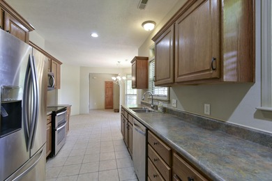 Charming home in this beautiful golf course community. there is on Ledgestone Country Club and Golf Course in Missouri - for sale on GolfHomes.com, golf home, golf lot