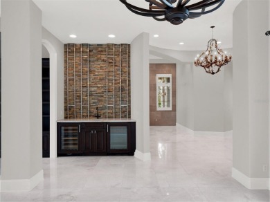 A perfect blend of Mediterranean and contemporary Transitional on Lake Nona Golf Club, Inc. in Florida - for sale on GolfHomes.com, golf home, golf lot