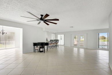 Panoramic golf and lake views abound at this Sandpiper Bay gem! on The Saints At Port St Lucie Golf Course in Florida - for sale on GolfHomes.com, golf home, golf lot