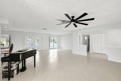 Panoramic golf and lake views abound at this Sandpiper Bay gem! on The Saints At Port St Lucie Golf Course in Florida - for sale on GolfHomes.com, golf home, golf lot