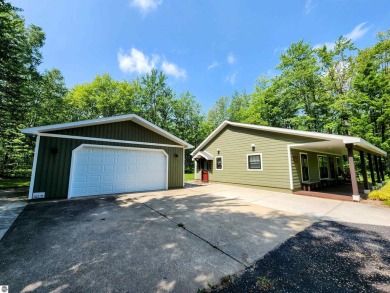 Built in 2018, this charming 3 bedroom, 2 bath ranch-style home on Lakes of the North Deer Run Golf Course in Michigan - for sale on GolfHomes.com, golf home, golf lot