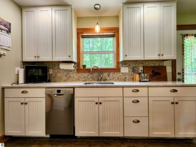 Built in 2018, this charming 3 bedroom, 2 bath ranch-style home on Lakes of the North Deer Run Golf Course in Michigan - for sale on GolfHomes.com, golf home, golf lot