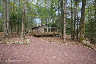 Let the outside in with this beautiful original Lake Naomi cabin on Lake Naomi Timber Trails Golf Club in Pennsylvania - for sale on GolfHomes.com, golf home, golf lot