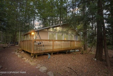 Let the outside in with this beautiful original Lake Naomi cabin on Lake Naomi Timber Trails Golf Club in Pennsylvania - for sale on GolfHomes.com, golf home, golf lot