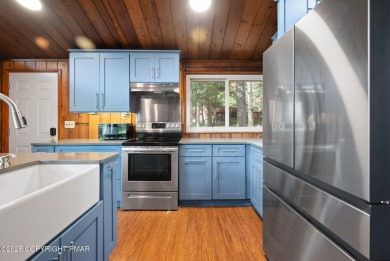 Let the outside in with this beautiful original Lake Naomi cabin on Lake Naomi Timber Trails Golf Club in Pennsylvania - for sale on GolfHomes.com, golf home, golf lot