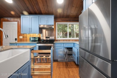 Let the outside in with this beautiful original Lake Naomi cabin on Lake Naomi Timber Trails Golf Club in Pennsylvania - for sale on GolfHomes.com, golf home, golf lot