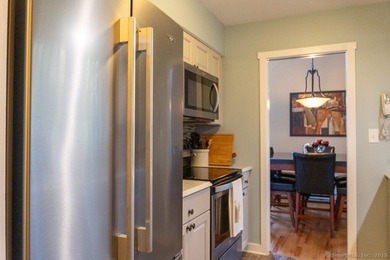 EXCEPTIONAL FIRST FLOOR END UNIT WITH GOLF COURSE FRONTAGE AND on  in Connecticut - for sale on GolfHomes.com, golf home, golf lot