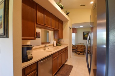 Enjoy golf course frontage in this beautifully maintained on Tampa Bay Golf and Country Club in Florida - for sale on GolfHomes.com, golf home, golf lot