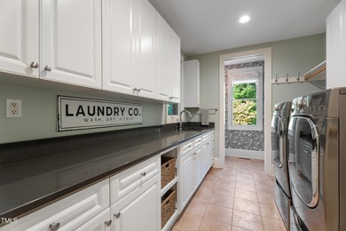 Crafted with care and brimming with delightful surprises, 32430 on Governors Club in North Carolina - for sale on GolfHomes.com, golf home, golf lot