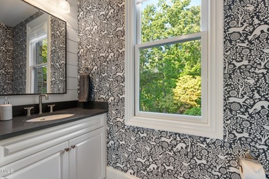 Crafted with care and brimming with delightful surprises, 32430 on Governors Club in North Carolina - for sale on GolfHomes.com, golf home, golf lot