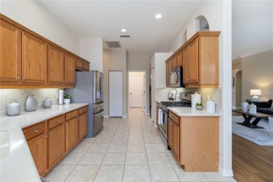 Welcome to a home that blends comfort, convenience, and a view on Links At Greenfield Plantation in Florida - for sale on GolfHomes.com, golf home, golf lot