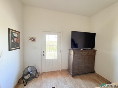 PANORAMIC VIEWS TO ENJOY FROM INDOORS OR THE COVERED PATIO on Sierra Del Rio Golf Club in New Mexico - for sale on GolfHomes.com, golf home, golf lot