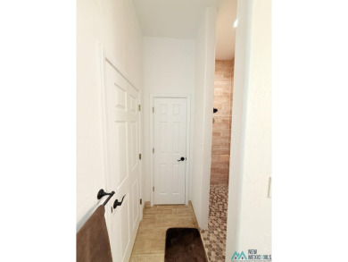 PANORAMIC VIEWS TO ENJOY FROM INDOORS OR THE COVERED PATIO on Sierra Del Rio Golf Club in New Mexico - for sale on GolfHomes.com, golf home, golf lot