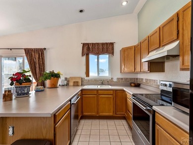 Nestled in the heart of the Pueblo West Golf Course community on Desert Hawk At Pueblo West in Colorado - for sale on GolfHomes.com, golf home, golf lot