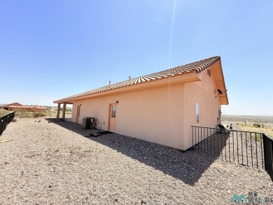 PANORAMIC VIEWS TO ENJOY FROM INDOORS OR THE COVERED PATIO on Sierra Del Rio Golf Club in New Mexico - for sale on GolfHomes.com, golf home, golf lot