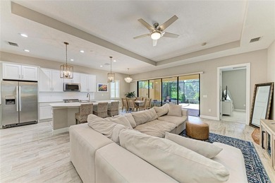 Experience tranquil Florida living in this stunning WCI-built on Sarasota National Golf Club in Florida - for sale on GolfHomes.com, golf home, golf lot