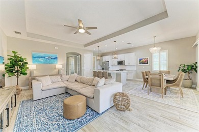 Experience tranquil Florida living in this stunning WCI-built on Sarasota National Golf Club in Florida - for sale on GolfHomes.com, golf home, golf lot