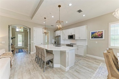 Experience tranquil Florida living in this stunning WCI-built on Sarasota National Golf Club in Florida - for sale on GolfHomes.com, golf home, golf lot