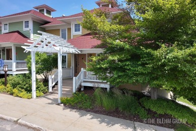Discover your dream ski getaway in this 2-story, end-unit on Crystal Mountain Golf Course in Michigan - for sale on GolfHomes.com, golf home, golf lot