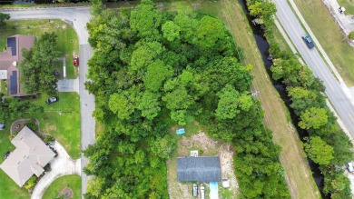 Nestled in the heart of New Smyrna Beach, this treed buildable on New Smyrna Beach Golf Course in Florida - for sale on GolfHomes.com, golf home, golf lot